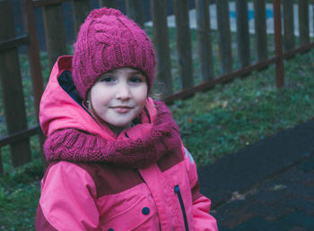 Portrait of cute smiling girl in snow