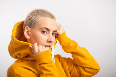 Portrait of cute boy against white background