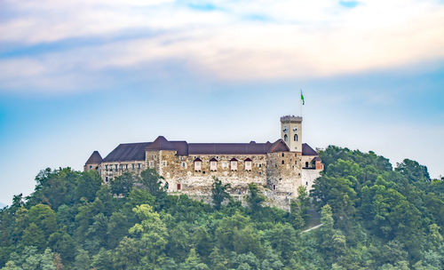 Low angle view of castle against cloudy sky