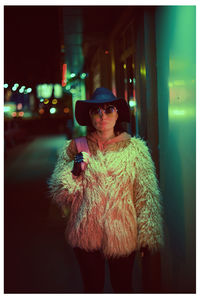 Portrait of man standing at night