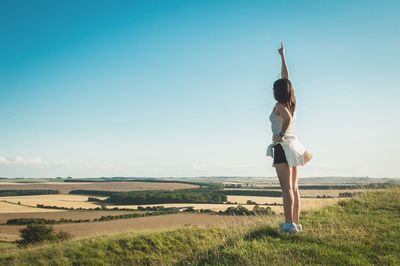 Full length of woman standing on field