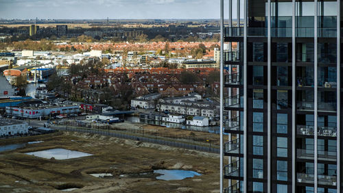 High angle view of buildings seen through glass window