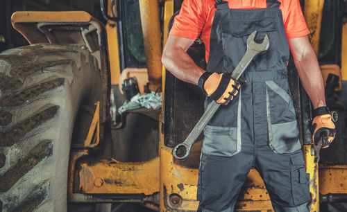 Midsection of man working at construction site