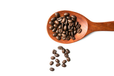 Directly above shot of coffee beans against white background