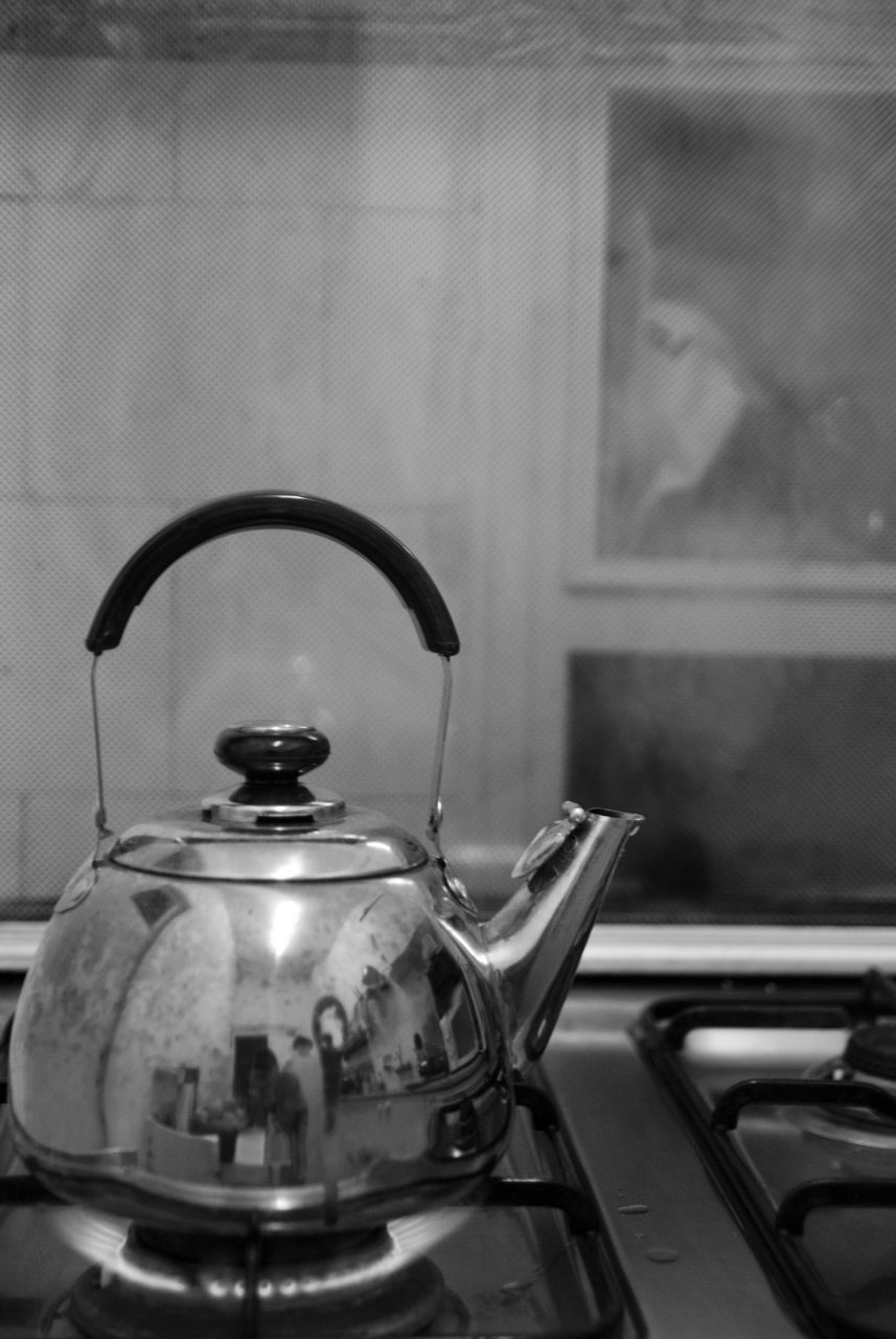 CLOSE-UP OF ELECTRIC LAMP ON TABLE IN HOME