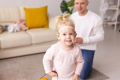 Portrait of cute girl playing at home