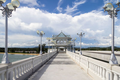 Bridge over street against sky