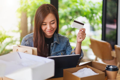 Young woman using phone