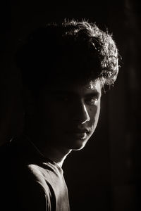 Close-up portrait of young man looking away