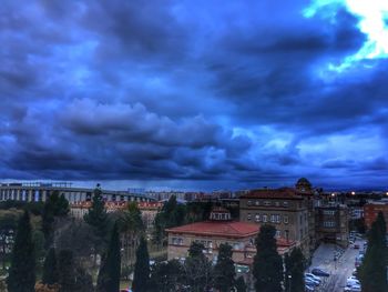 Cityscape against cloudy sky