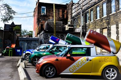 Cars on street against buildings in city