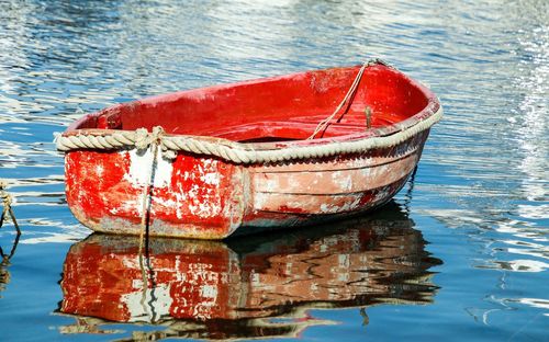 High angle view of red boat moored in sea