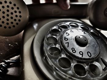 Close-up of telephone booth on table