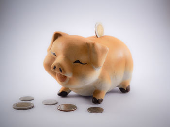 Close-up of figurine against white background