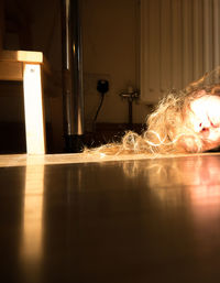 Close-up of illuminated light painting on floor at home