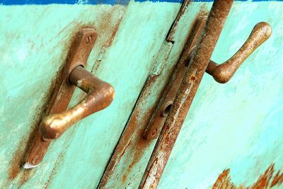 Close-up of rusty metal on wooden door