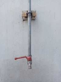 Close-up of pipes mounted on wall