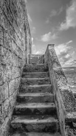 Low angle view of staircase against sky