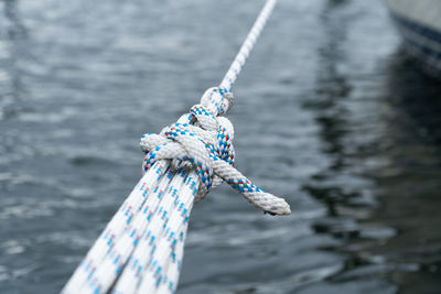 Close-up of rope tied to bollard