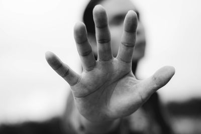 Close-up of man gesturing outdoors