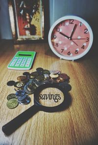 Close-up of clock on table