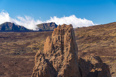 Panoramic view of rocky mountains against sky