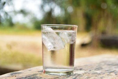 Close-up of tonic water glass on table