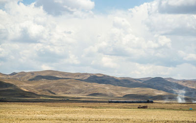 Scenic view of field against sky