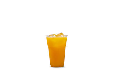 Yellow drink against white background