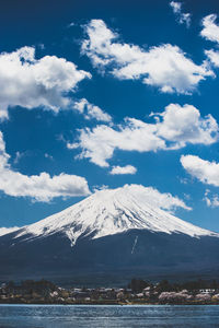 Scenic view of snowcapped mountains against blue sky