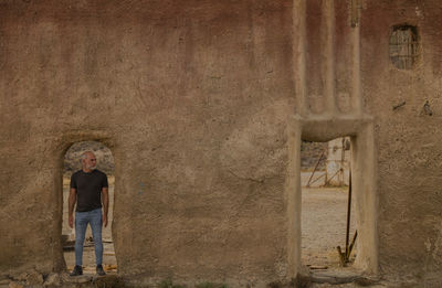 Adult man in film set in tabernas desert, almeria, spain