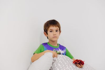 Portrait of boy against white background