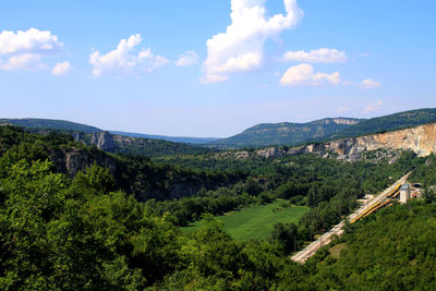 Idyllic shot of green landscape against sky