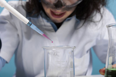 Close-up of young woman working in laboratory