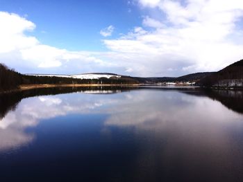 Reflection of clouds in calm lake