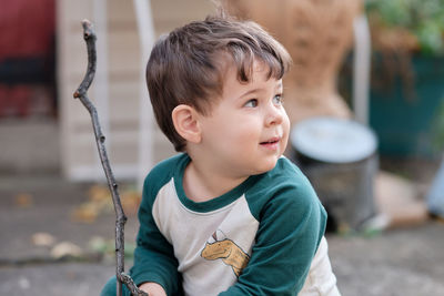 Cute little boy playing in the backyard