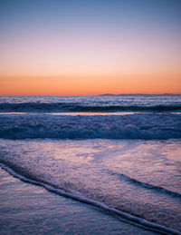 Scenic view of sea at sunset