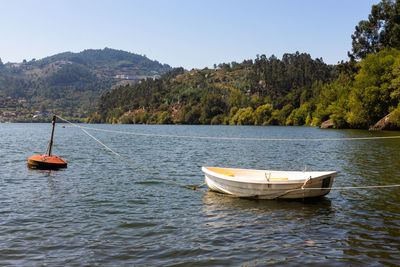 View of sailboat in river against sky