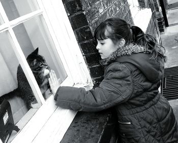 Woman standing against wall