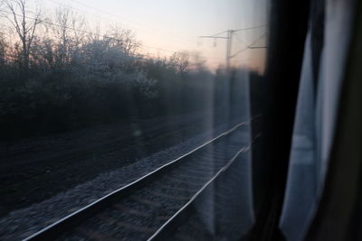 Railroad tracks in foggy weather