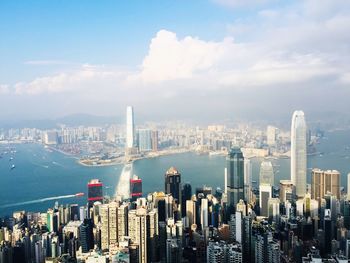 Panoramic view of modern buildings in city against sky