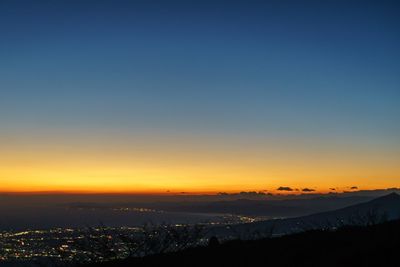 Scenic view of cityscape at sunset