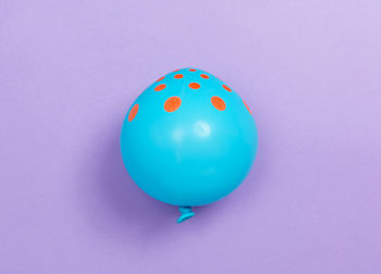 High angle view of balloons against blue background