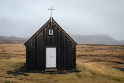 House on field against sky