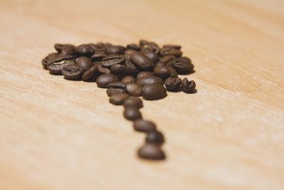 Close-up of coffee beans on table