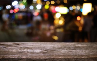 Defocused image of illuminated city street at night