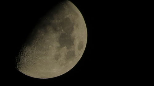 Low angle view of moon against sky at night