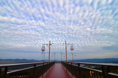 Pier over sea against sky