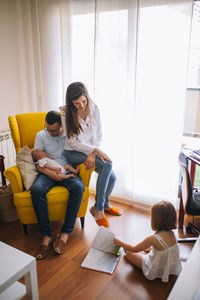 Family of four with newborn baby. mom dad older sister and little brother.