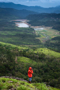 High angle view of man standing on mountains